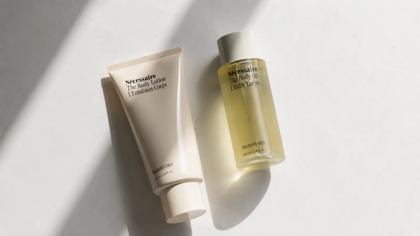 Flat lay of a sparse skincare routine: one cleanser, one moisturizer, no clutter
